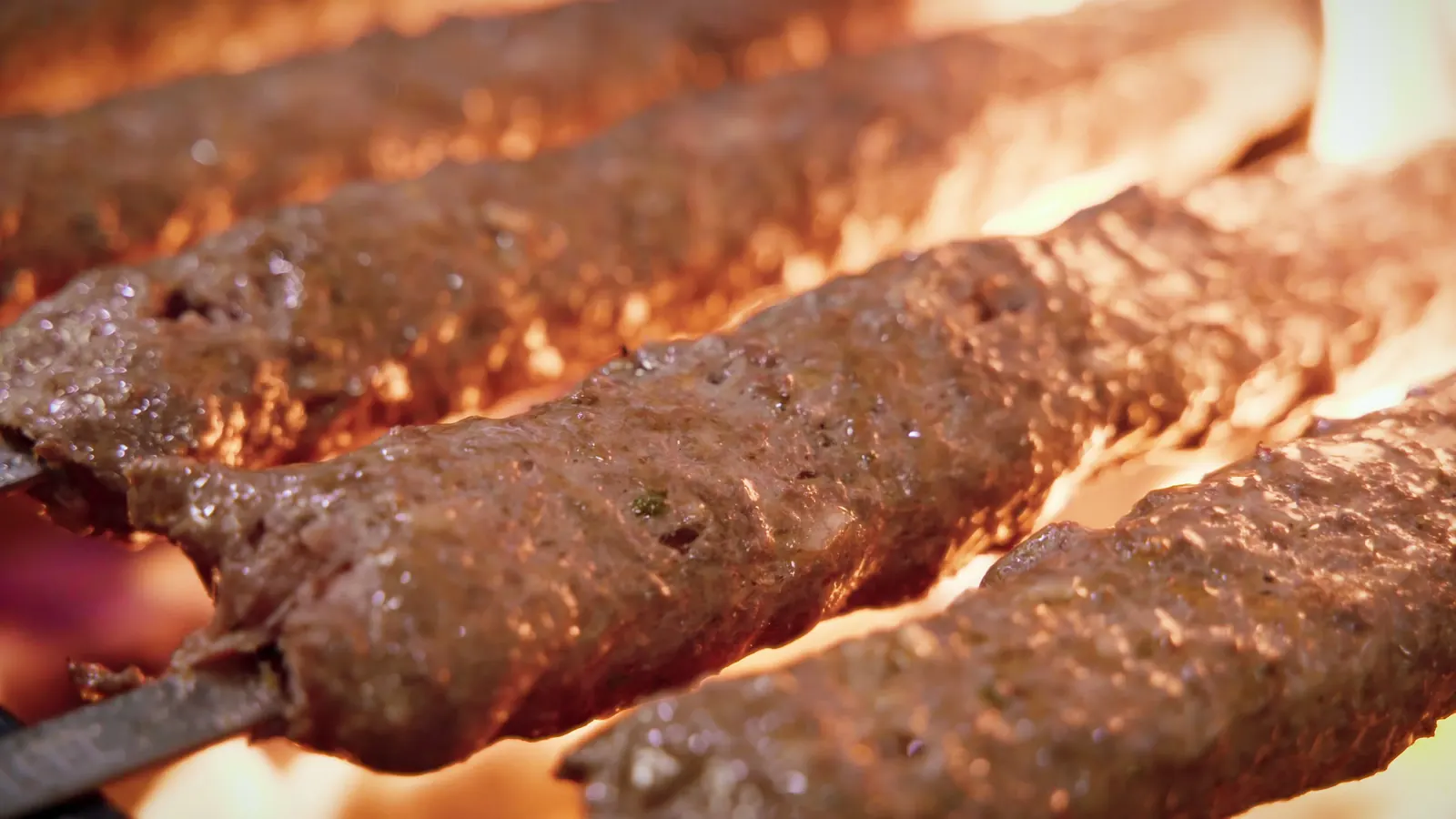 Adana kebab skewers on the grill