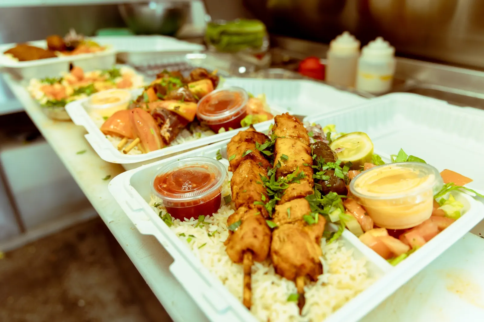 Kebab plates lined up for a catering order