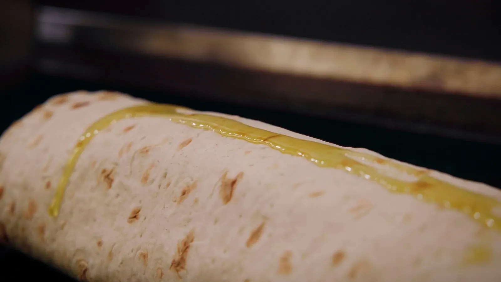 Garlic butter brushed over grilled lavash